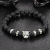 Handgjort armband silver leopard svarta lavastenar