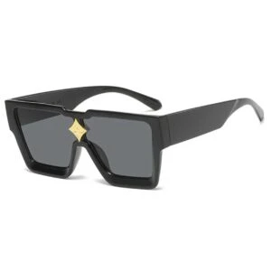Exklusiva Solglasögon med Gulddetalj Svart